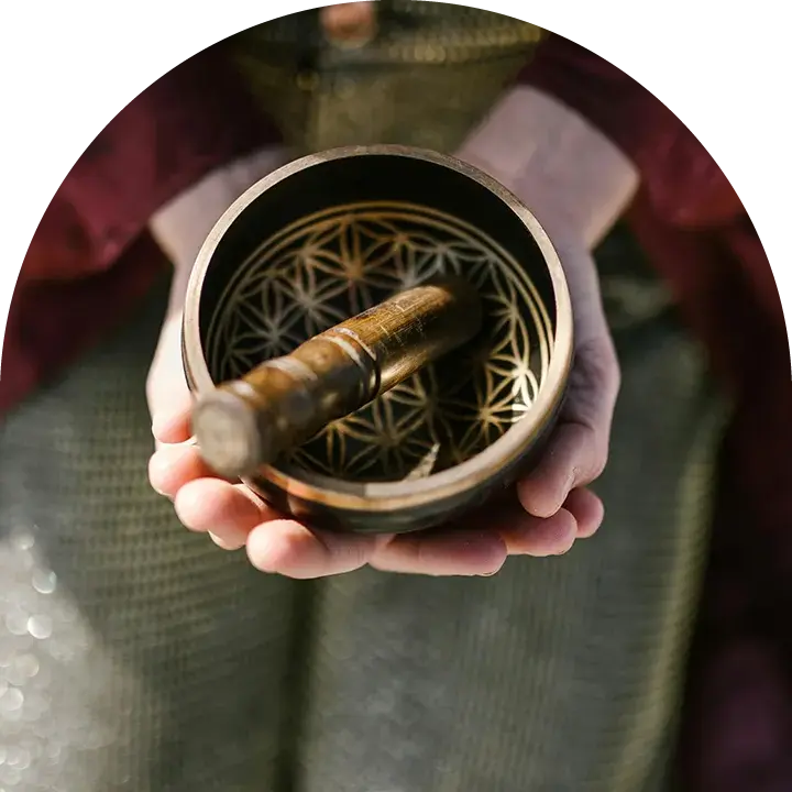 Person holding singing bowl